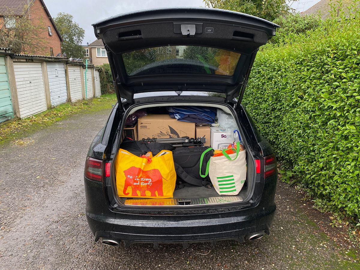 Rear of a Jaguar Sportbbrake with lots of stuff in it