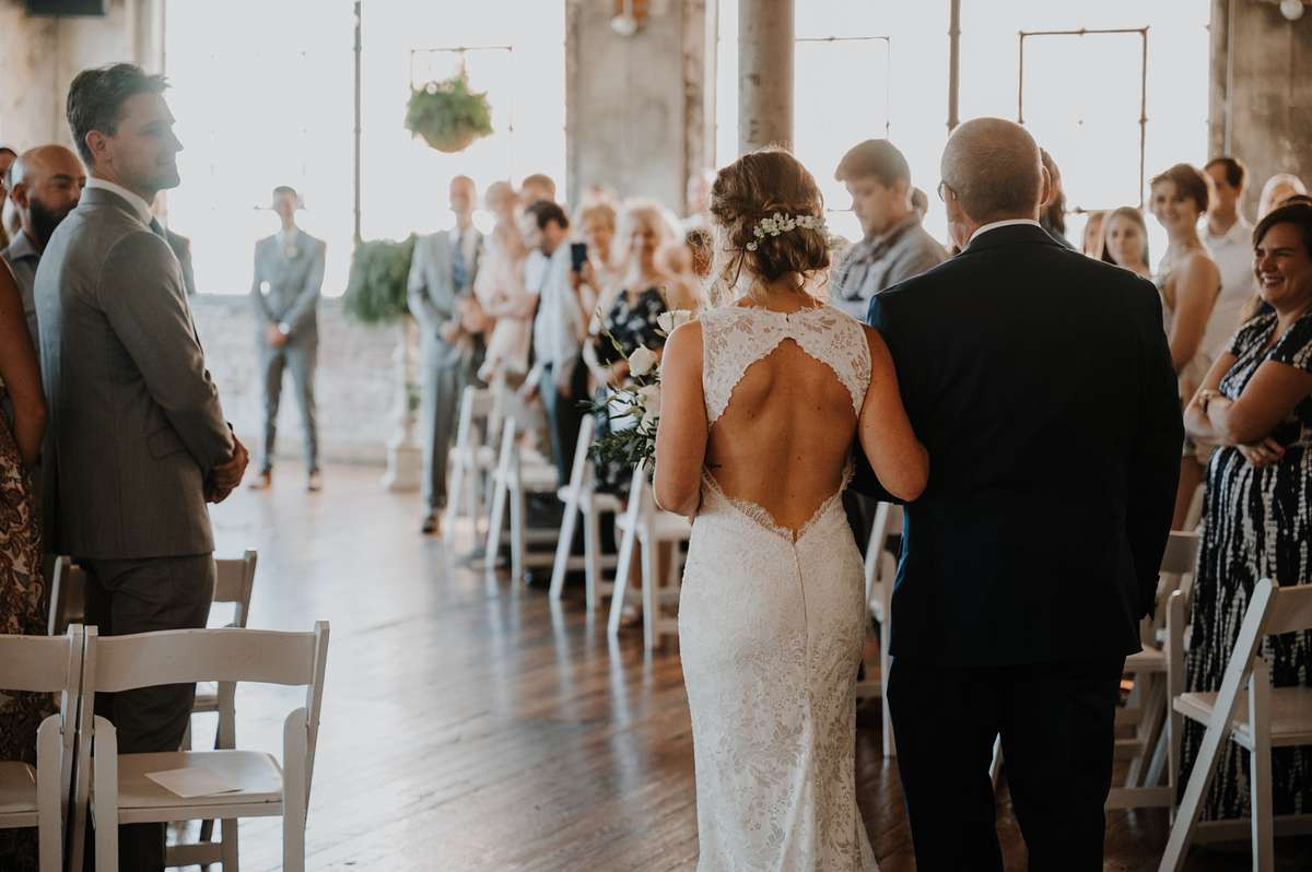 Upscale Colorado wedding photography, bride walking down the aisle