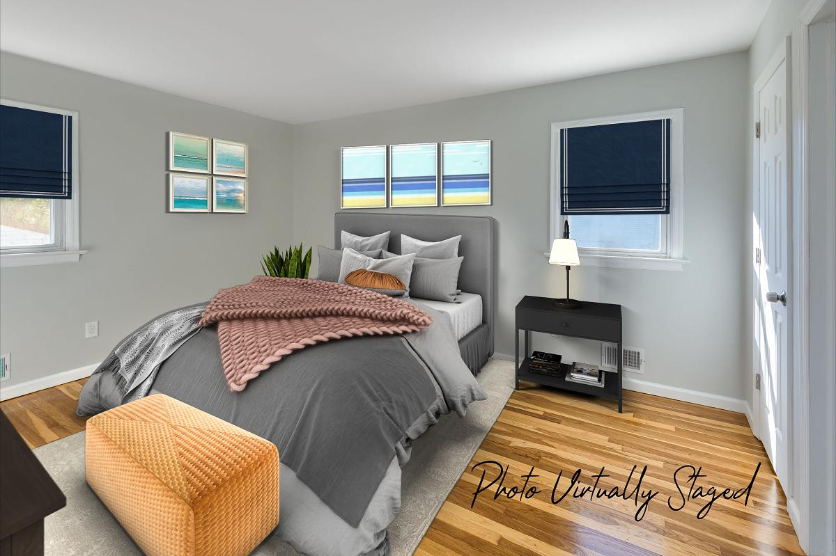 Same room (Master bedroom) but virtually staged by a Fords real estate photographer